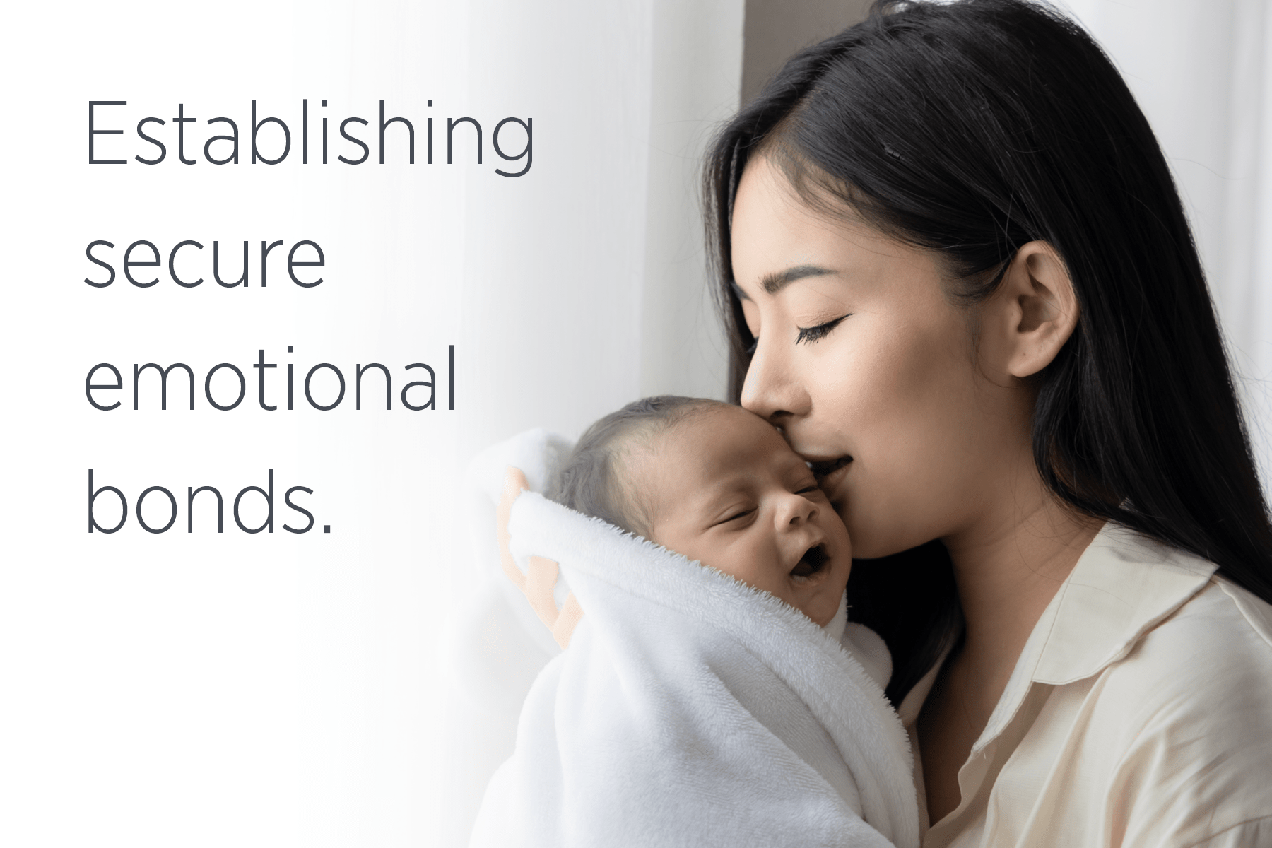 A woman kissing her swaddled baby with text overlay that says, "Establishing secure emotional bonds."