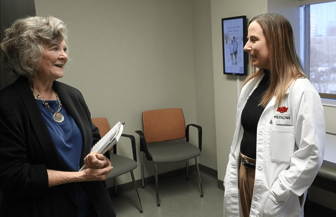 Heart Health for Women A woman speaks with a doctor in an examination room.