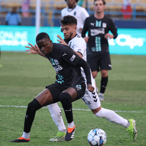 News FC Tulsa Two soccer players compete for control of the ball.