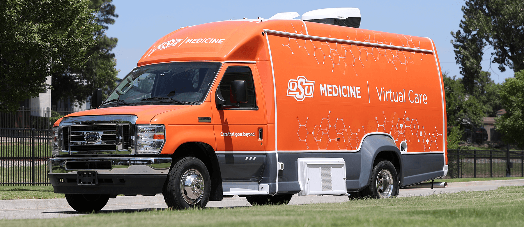 virtual-care-van-lg A large orange Ford OSU Medicine virtual care vehicle.
